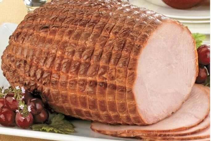 Representative whole smoked turkey breast sliced for serving